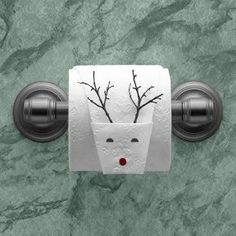 a toilet paper holder with reindeer's head on it