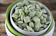 there is a bowl full of green dog treats