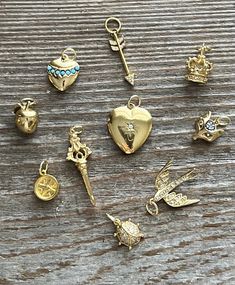 These are retired charms from a charm necklace. The stones are CZ and the gold vermeil is bright with no loss. I have added sturdy gold filled jump rings. They have all stones intact. All charms are 3D and sparkle! Yellow Gold Charm Bracelet With Dangle Shape, Heart Charm Dangle Charms For Anniversary, Round Dangling Charms For Everyday, Heart Dangle Charms For Anniversary, Everyday Round Dangling Charms, 14k Yellow Gold Jewelry With Removable Charms, Anniversary Jewelry In Yellow Gold With Removable Charms, Anniversary Heart Dangle Charms, Anniversary Yellow Gold Jewelry With Removable Charms