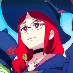 a woman with long red hair wearing glasses and a black hat is looking at the camera