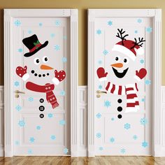 two doors decorated with snowmen and hats