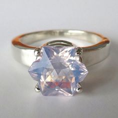 This Unique Ring Features Stunning Top-Grade Natural Lavender Pink Amethyst Cut Into A Snowflake Shape. This Amethyst Is Of A Great Size And Exceptional Quality (Weight 2.68, Clarity Vvs, Size 10.4x9.0mm, Origin Beazil). The Stone Has Gorgeous Color Soft Lavender With A Bit Of Pink. The Stone Has A Lot Of Sparkle Thanks To Master Facet. It Was Cut Into Snoflake Shape That Also Looks Like A Star Or A Flower. Elegant Sterling Silver Setting Securely Holds This Beautiful Stone By Four Prongs. Stunn Elegant White Amethyst Ring Gift, Elegant Faceted Silver Amethyst Ring, Silver Star-shaped Formal Rings, Silver Star-shaped Ring For Formal Occasions, Silver Celestial Jewelry With Center Stone, Silver Faceted Amethyst Ring As Gift, Celestial Silver Jewelry With Center Stone, Luxury Silver Star-shaped Ring, Formal Silver Kunzite Jewelry