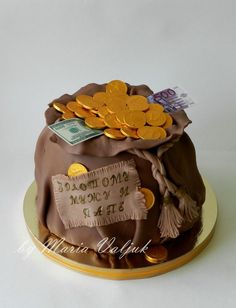 a cake decorated with money and gold coins