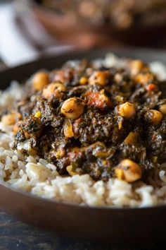 a bowl filled with rice and beans on top of a table