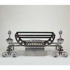 a metal bench with four candles on it