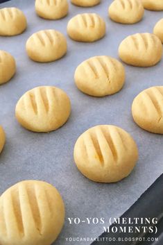 freshly baked cookies are lined up on a cookie sheet in the oven, ready to be baked