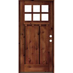 a wooden door with glass on the side