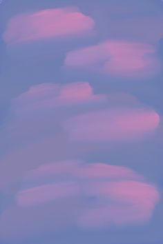 some pink clouds are in the sky and one is flying through the air with it's tail