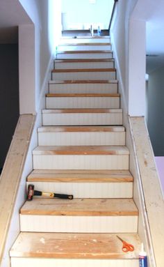 the stairs are made of wood and have been painted white