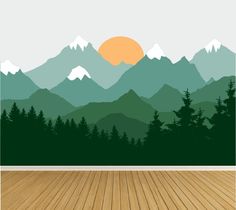 an empty room with wood flooring and mountains in the background