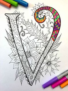 an image of a coloring book page with the letter v on it and some markers next to it