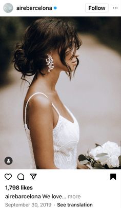 a woman in a white dress holding a bouquet