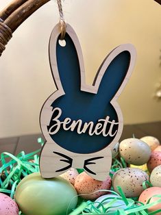 a basket filled with eggs and an easter decoration