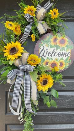 a sunflower wreath is hanging on the front door