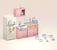 a kitchen with pink appliances and dishes on the counter, in front of a white refrigerator