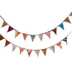 a multicolored bunting banner is hanging from the side of a white wall