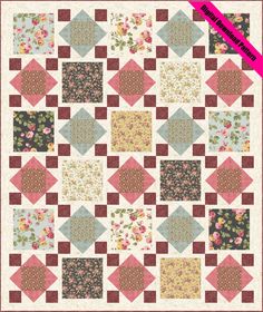 a quilt with many different colors and patterns on the front, along with a pink ribbon