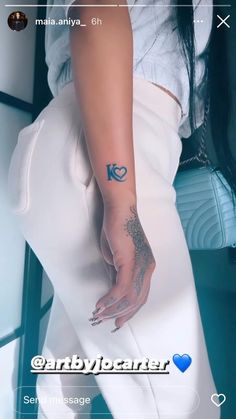 a woman with a tattoo on her arm