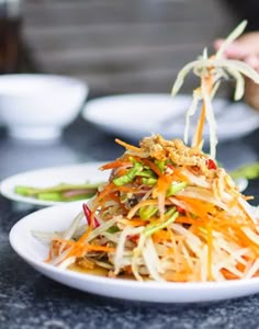 a white plate topped with lots of veggies