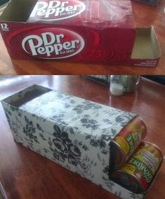 an empty box with dr pepper in it on top of a table next to a can of soda