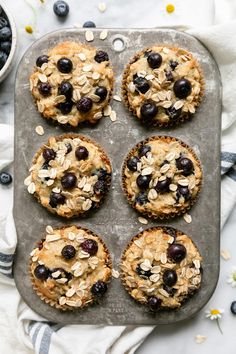 blueberry oatmeal muffins with yogurt on a baking sheet