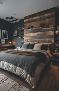 a large bed sitting in the middle of a bedroom next to a wooden headboard