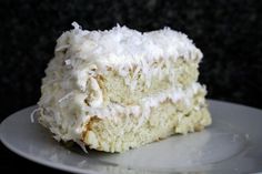 a piece of coconut cake on a white plate