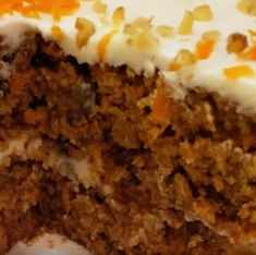 a piece of carrot cake with white frosting