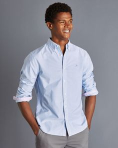 100% cotton, Contrast trim detailing and chest embroidery, Button-down collar, Rounded button cuff with two buttons, Oxford Weave, Natural stretch, Garment washed for a softer finish, Classic and Slim fit: Back pleats, Extra slim fit: Back darts - Button-Down Collar Washed Oxford Stripe Shirt - Ocean Blue Charles Tyrwhitt Shirt, Charles Tyrwhitt, Stripe Shirt, Oxford Fabric, Button Down Collar, Contrast Trim, Ocean Blue, Blue Ocean, Striped Shirt