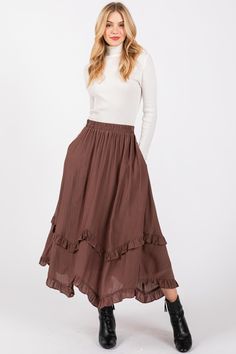 Introducing the Desert Moon Ruffle Detail Flare High Waist Midi Skirt, a beautiful blend of elegance and free-spirited charm. Crafted with a flowy 100% polyester outer layer and a soft 100% rayon lining, this skirt offers both comfort and style, making it perfect for day-to-night wear. The high waist design creates a flattering silhouette, while the ruffle detailing adds a feminine touch and a hint of movement with every step. The flare of the skirt enhances the graceful, breezy feel, making it a versatile piece that pairs effortlessly with anything from casual tops to more dressy blouses. Whether you're exploring the city or heading to a special occasion, the Desert Moon Midi Skirt brings a timeless bohemian flair to your outfit. The lightweight fabric and flowy design ensure you stay com