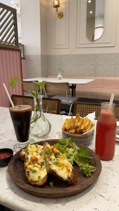 there is a plate of food on the table with fries and ketchup next to it