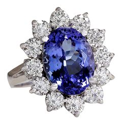 Stamped: 14K White Gold Total Ring Weight: 4.7 Grams Ring Length: N/ARing Width: N/A Gemstone Weight: Total Natural Tanzanite Weight is 4.48 Carat (Measures: 11.85x8.70 mm) Color: Blue Diamond Weight: Total Natural Diamond Weight is 1.50 Carat Quantity: 12 Color: F-G, Clarity: VS2-SI1 Face Measures: 18.80x16.80 mm Sku: [702606W] Oval Tanzanite Gemstones For Formal Occasions, Formal Round Cut Tanzanite Gemstones, Classic Tanzanite Multi-stone Jewelry, Classic Tanzanite Gemstones For Anniversary, Formal Tanzanite Multi-stone Gemstones, Formal Tanzanite Fine Jewelry Gemstones, Formal Tanzanite Fine Jewelry, Elegant Tanzanite Gemstones Gia Certified, Formal Tanzanite Multi-stone Diamond Ring