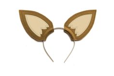 a cat ears headband made out of felt and leather with an animal's tail