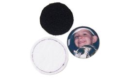 two buttons, one with a child's face and the other with a black circle