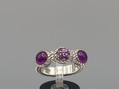 Designer Judith Ripka 925 Silver Rope Textured Pavé Amethyst Band Ring Size 8 Item w#1869 Clean and in good condition  Hallmarked Judith Ripka  925 Silver 8.1 grams Welcome to Westgate Jewels!! We specialize in vintage estate, designer, and fine jewelry. Our shop consists of items that are estate, antique, and / or vintage conditions unless otherwise noted. This means that most items are prior owned and may have some imperfections such as light scratches, scuffs, and / or patina. Our items are c Rope Texture, Resize Ring, Judith Ripka, Amethyst Gem, Purple Band, Amethyst Ring, Gold Charm, Band Ring, Band Rings