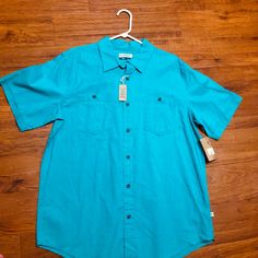 Teal Magellan Button Down. Never Worn Fitted Casual Shirt With Buttoned Pockets, Casual Summer Tops With Buttons, Summer Button-up Tops With Functional Buttons, Casual Light Blue Button-up Short Sleeve Shirt, Blue Short Sleeve Button-up Shirt With Placket, Blue Button-up Short Sleeve Shirt With Placket, Blue Relaxed Fit Shirt With Buttoned Pockets, Casual Cotton Tops With Functional Buttons, Light Blue Button-up Shirt With Buttons