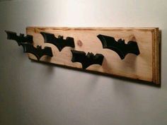 four bats mounted to the wall in a room