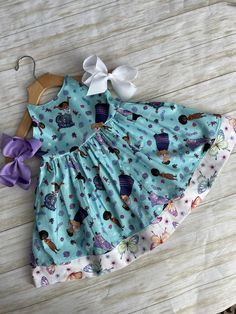 ★*.*'.*★ENCANTO/MIRABEL Baby/Toddler Dress★*.*'.*★ The dress is a sundress style, with extra long straps to make a fancy bow at the back.  The back has elastic for a snug fit. The bottom and straps are a coordinating fabric with butterflies for an extra fancy style. Available in sizes 6mth-8yrs Shipping time is currently 2-3 weeks for this dress We do our absolute best to get your dresses shipped faster than that, but we cannot currently promise dresses before the expected ship date. If you need Summer Princess Playtime Dress, Summer Princess Sleeveless Twirl Dress, Princess Style Sleeveless Twirl Dress For Summer, Princess Style Sleeveless Summer Twirl Dress, Sundress Style, Toddler Girl Dress, Fancy Bows, Coordinating Fabrics, Toddler Girl Dresses