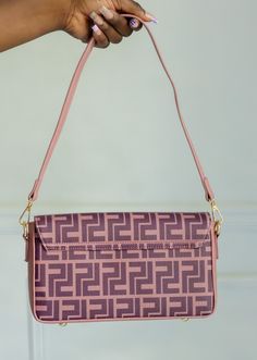 Our Jennifer Shoulder Bag is THE everyday piece. The DOUBLE P PRINT and gold accents this is a very eye catching vibe. Being one of our best sellers this stunning bag has plenty of inner storage where you can store all of your essentials. Length: 10 inches Width: 5 inches Height: 5.5 inches Purple Square Shoulder Bag With Large Capacity, Purple Large Capacity Square Shoulder Bag, Large Capacity Square Purple Shoulder Bag, Trendy Purple Satchel For Everyday Use, Trendy Purple Everyday Satchel, Purple Rectangular Baguette Bag For Everyday Use, Trendy Purple Shoulder Bag With Double Handle, Chic Purple Square Box Bag, Purple Crossbody Satchel With Gold-tone Hardware