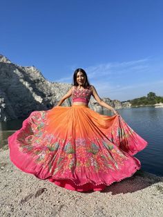 Orange printed skirt. Kardana Work, Off Shoulder Lehenga, Skirt With Corset, Ruffle Lehenga, Raw Silk Lehenga, Mirror Work Blouse, Ombre Fabric, Yellow Lehenga, Ivory Blouse