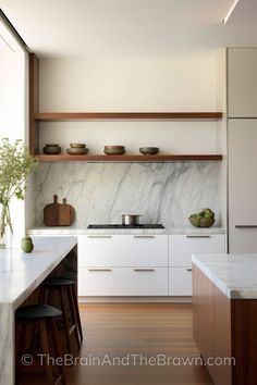 the kitchen is clean and ready for us to use it's marble countertops