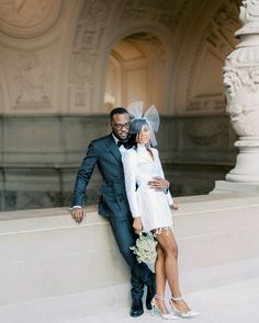 a bride and groom posing for a photo