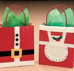 two bags with christmas decorations on them sitting next to each other