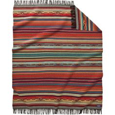 a multicolored blanket with fringes on it