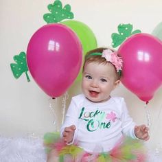 The "Lucky" tutu set is made with layers of green, lime green, shocking pink and light pink tulle. This set includes options for options for a matching crown headband and a white 'lucky one' bodysuit. Our tutus are made on a ribbon-tie waistband that ties and unties at the bow for a custom fit.  Click 'more' for sizing charts!  Headbands will always match the outfit and style pictured, but may come with a different color combination. If you’re looking for something specific, please let us know! Lucky One First Birthday Girl, Lucky One First Birthday, Birthday St Patricks Day, Pattys Day Outfit, St Patricks Day Birthday, St Pattys Day Outfit, Birthday One, St Patrick's Day Outfit, Shocking Pink