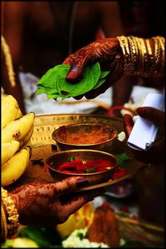 a woman is serving food to another person