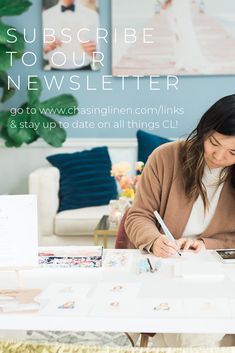 a woman sitting at a table writing on a piece of paper with the words subscribe to your news letter