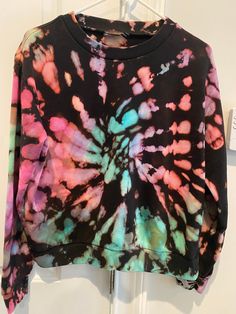 This is a black cotton blend crew neck sweatshirt in a rainbow pastel swirl.  Crew neck.  Very soft and comfortable. Can be worn with jeans or sweats.  There will be some variation with the finished product.  Larger sizes available  Machine wash cold and hang dry to prevent shrinking Casual Rainbow Crew Neck Sweatshirt, Casual Multicolor Hand Dyed Sweatshirt, Trendy Tie-dye Sweatshirt Relaxed Fit, Trendy Tie Dye Sweatshirt Relaxed Fit, Hand Dyed Multicolor Relaxed Fit Sweatshirt, Tie Dye Rainbow Print Crew Neck Top, Trendy Tie Dye Sweatshirt With Relaxed Fit, Tie Dye Crew Neck Sweatshirt For Spring, Tie Dye Crew Neck Top With Rainbow Print