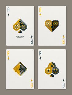 four playing cards with the same design on each card, one in gold and two in black