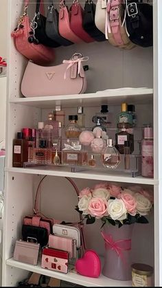 the shelves are filled with purses, perfume bottles and other personal care items for women